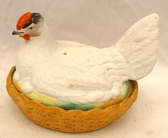 Staffordshire white hen on nest