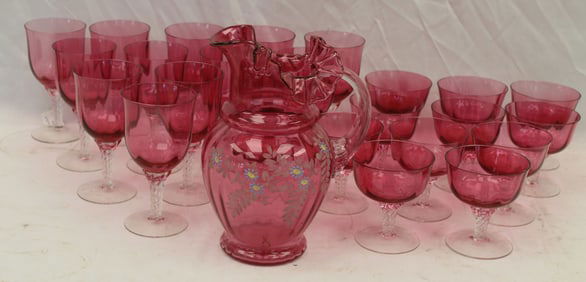 Lot of 25 pcs of pink to clear glass incl 2 sets of 12 wines plus a pink/cranberry glass pitcher