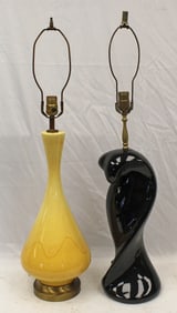 Lot of 2 table lamps incl a yellow pottery & a black glass/porcelain example