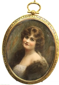 Miniature portrait of a woman in ni e oval brass frame