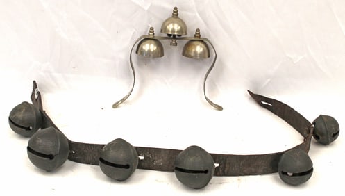 Antique bell lot incl leather strapped sleigh bells & a set of "door" bells
