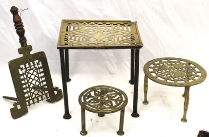 Lot of 4 brass & iron footman trivets - 4"-9" tall