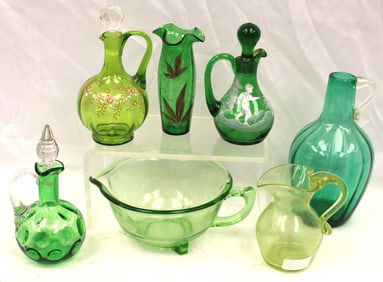 Lot of 7 pieces of Victorian green glass incl cruets, pitchers, vase, etc