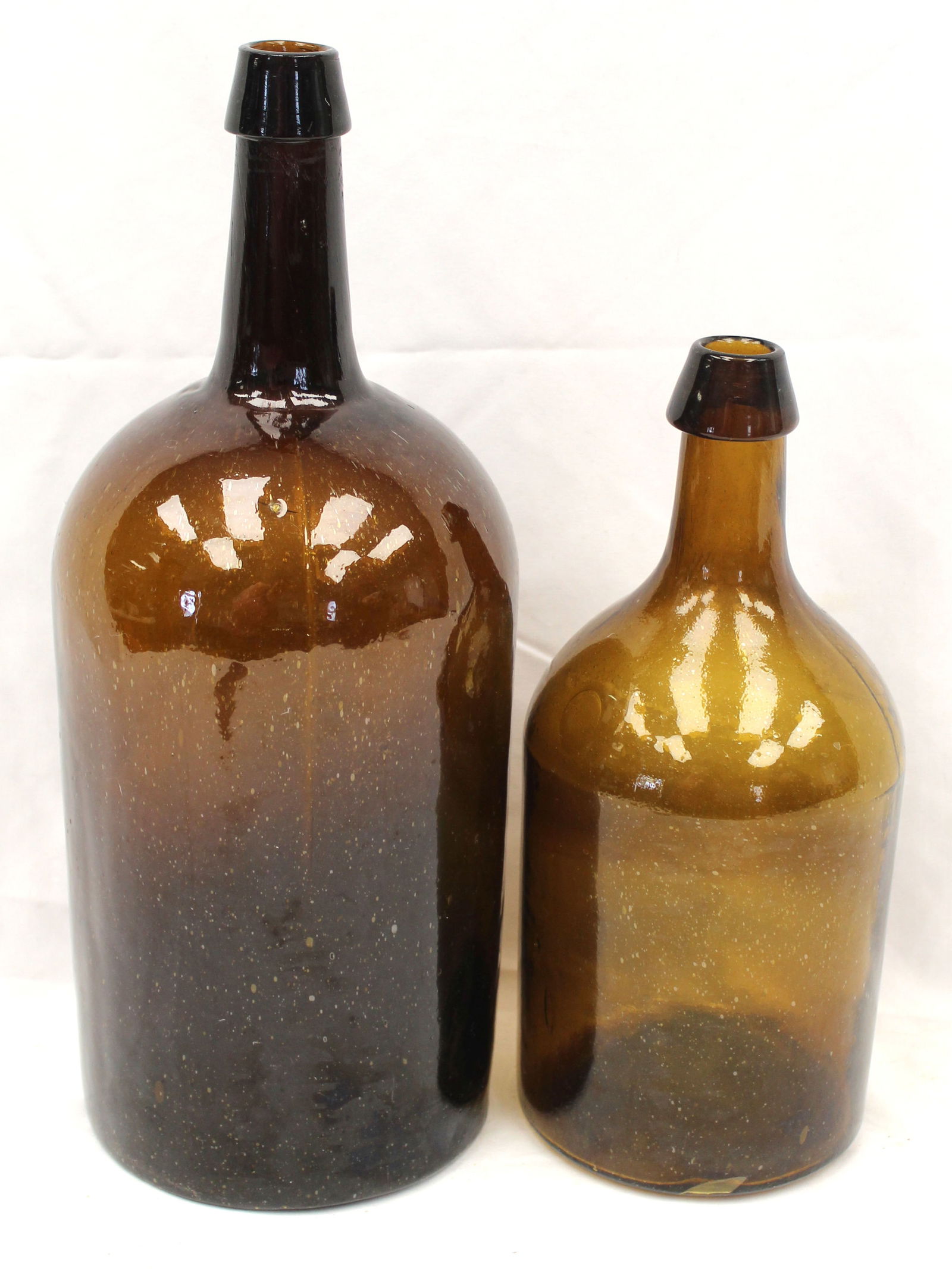 Lot of 2 antique amber glass bottles - 12" & 15" tall (1 of 7)
