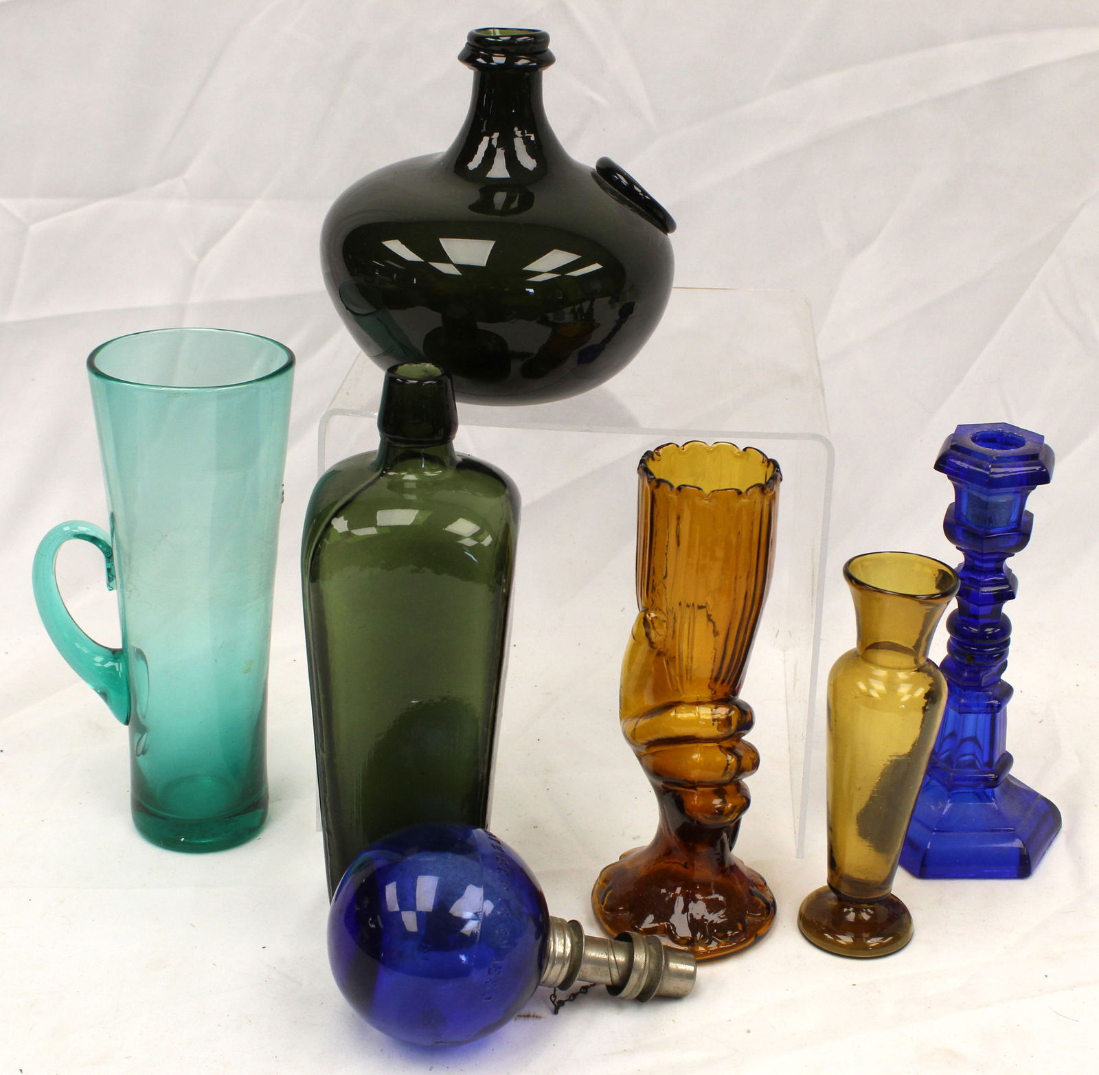 Lot of 7 glass items incl tall aqua handled glass, cobalt candlestick, amber vases, green gin (1 of 6)
