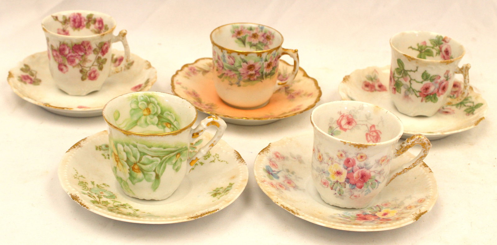 Lot of 5 porcelain cups & saucers: Lot of 5 porcelain cups & saucers
