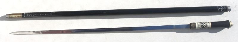 antique sword cane in ebonized wood featuring bone: antique sword cane in ebonized wood featuring bone & brass lion head finial - 36"