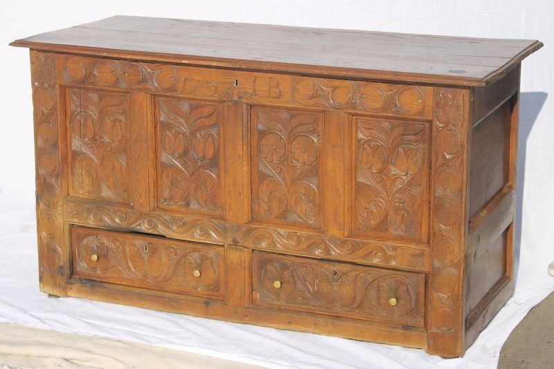 sgnd I.B. (believed to be Isaac Bradley) & dated 1: sgnd I.B. (believed to be Isaac Bradley) & dated 1727 New Bedford, MA area carved tulip & sunflower paneled blanket chest in ash & chestnut. Although the chest is dated 1727 the chest construction see