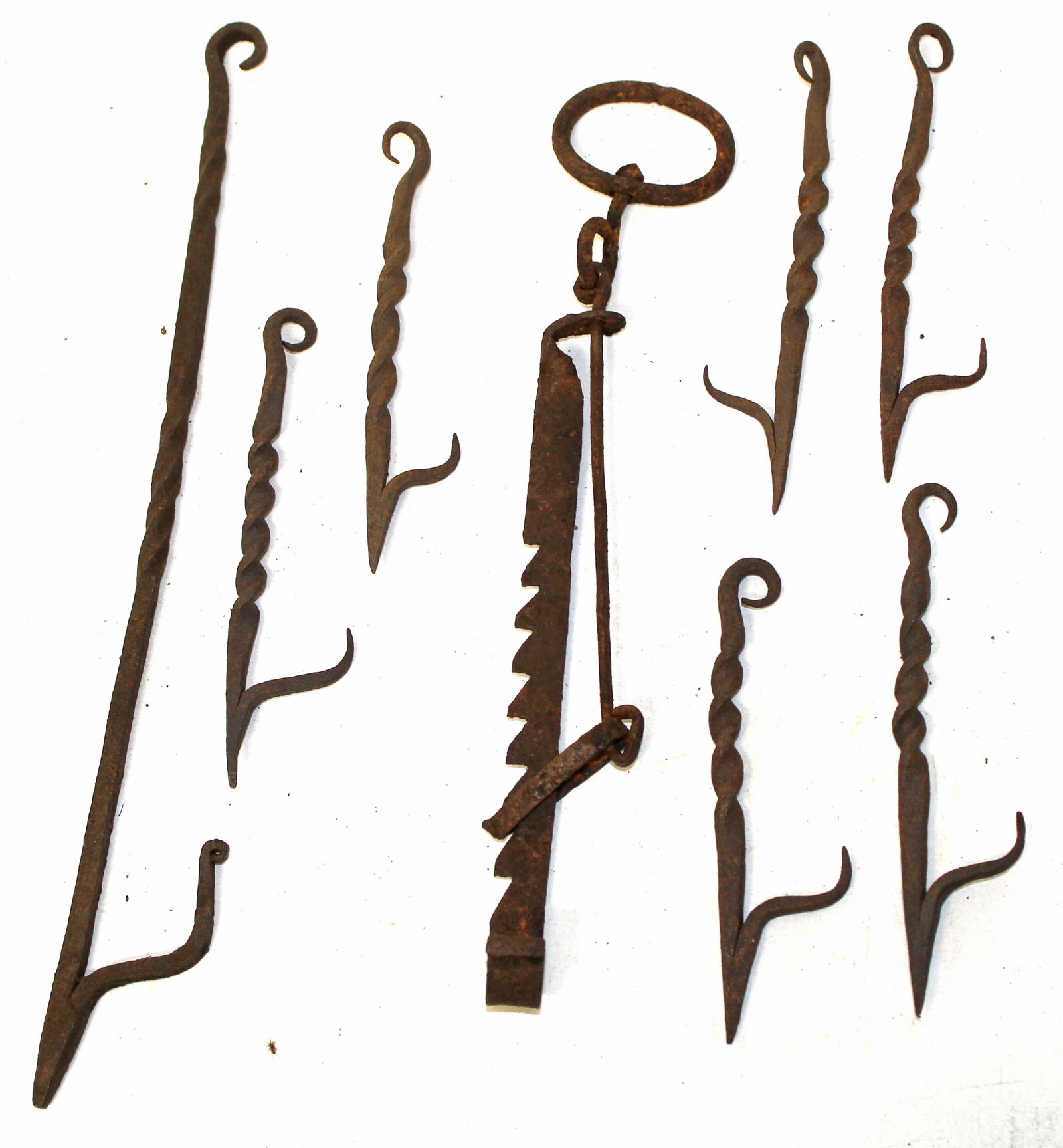 Group of iron betty lamp hangers in unusual forms - 6"-11" long: Group of iron betty lamp hangers in unusual forms - 6"-11" long