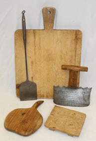 Antique lollipop handled breadboard w chopper, mold, butter paddle & iron spatula