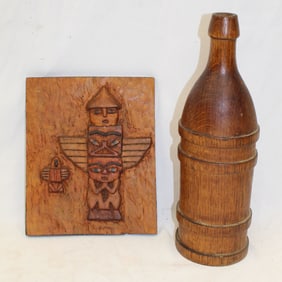 Lot of 2 carved wooden items incl bottle & carved board w totem pole motif - 12" tall & 8 1/4"x7"