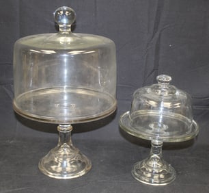 Lot of 2 glass cake stands w covers - 17" tall x 10" diam & 11" tall x 8" diam