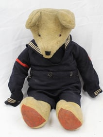 Antique large teddy bear in military uniform -
