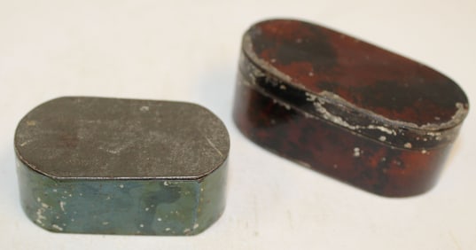 Lot of 2 antique tin travel nutmeg graters in green & tortoise paint dec - 2" & 3" wide