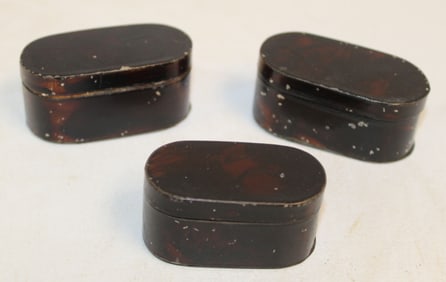 Lot of 3 antique tin travel nutmeg graters in tortoise paint dec w inlay - each approx 2" - 2 1/2"