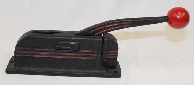 Cast iron painted red & black nutcracker - 10 1/2" long c 5" tall