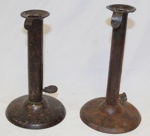 Lot of 2 antique tin push up hogscraper candlesticks - 6 1/2" & 7" tall