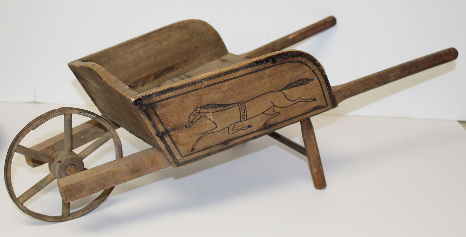 Wooden child size wheelbarrow w inscribed horse decoration on side - 8 1/2" tall x 28" long (1 of 5)