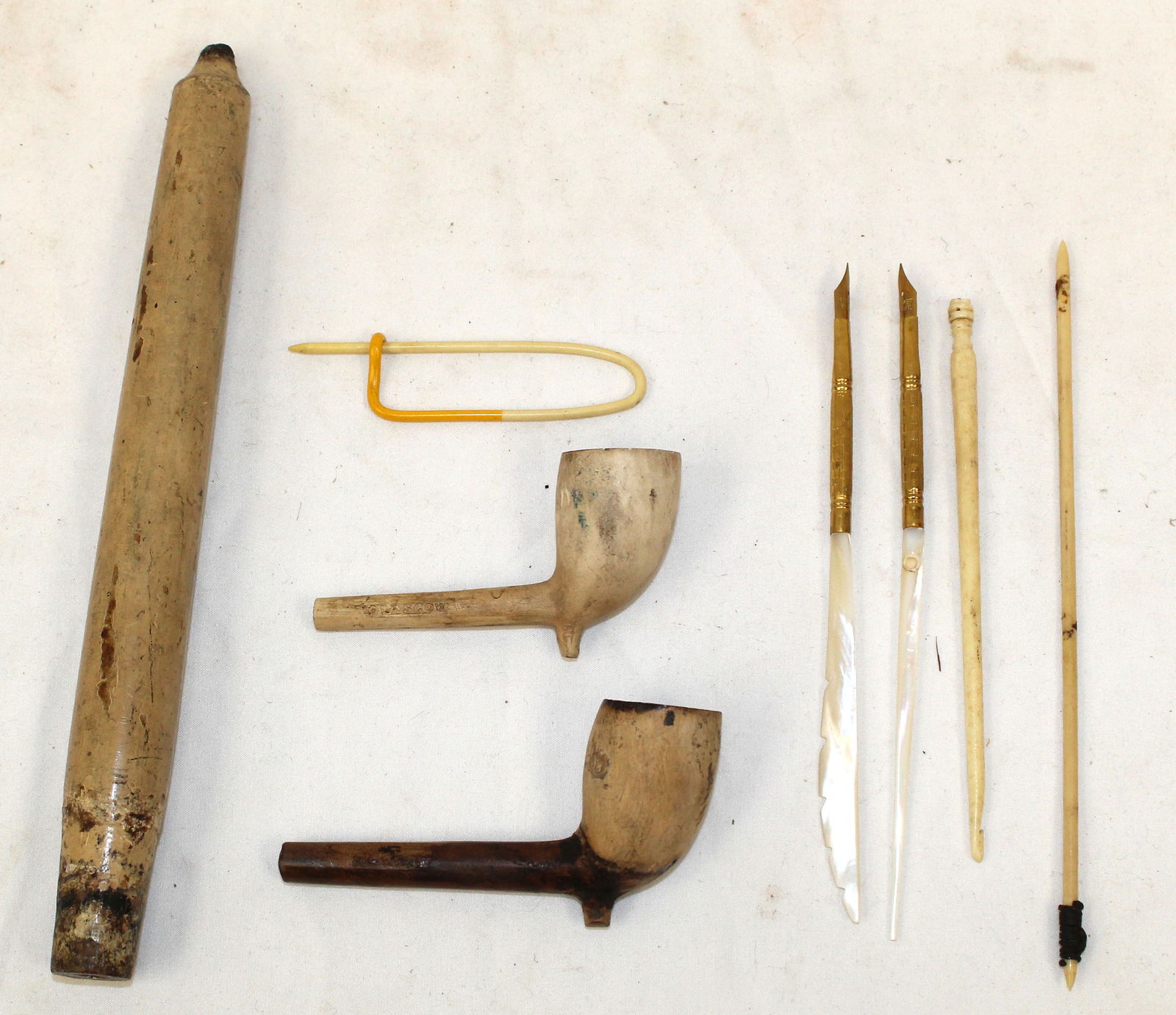 Lot of clay pipes, wooden candle & bone items - 3" - 9" long: Lot of clay pipes, wooden candle & bone items - 3" - 9" long