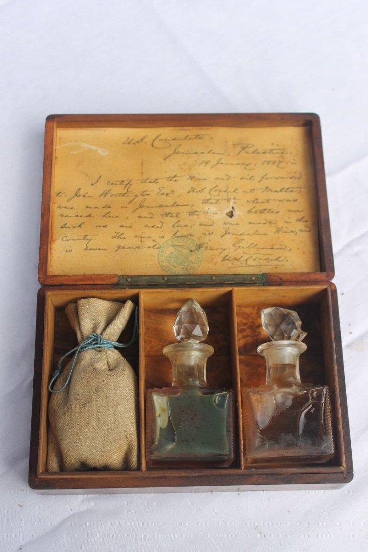 dated 1887 olivewood box from Jerusalem holding 2 small: dated 1887 olivewood box from Jerusalem holding 2 small bottles containing oil & wine & a miniature bag of wheat (US Consolate official writing) - box is 4 1/4" x 6 1/2"