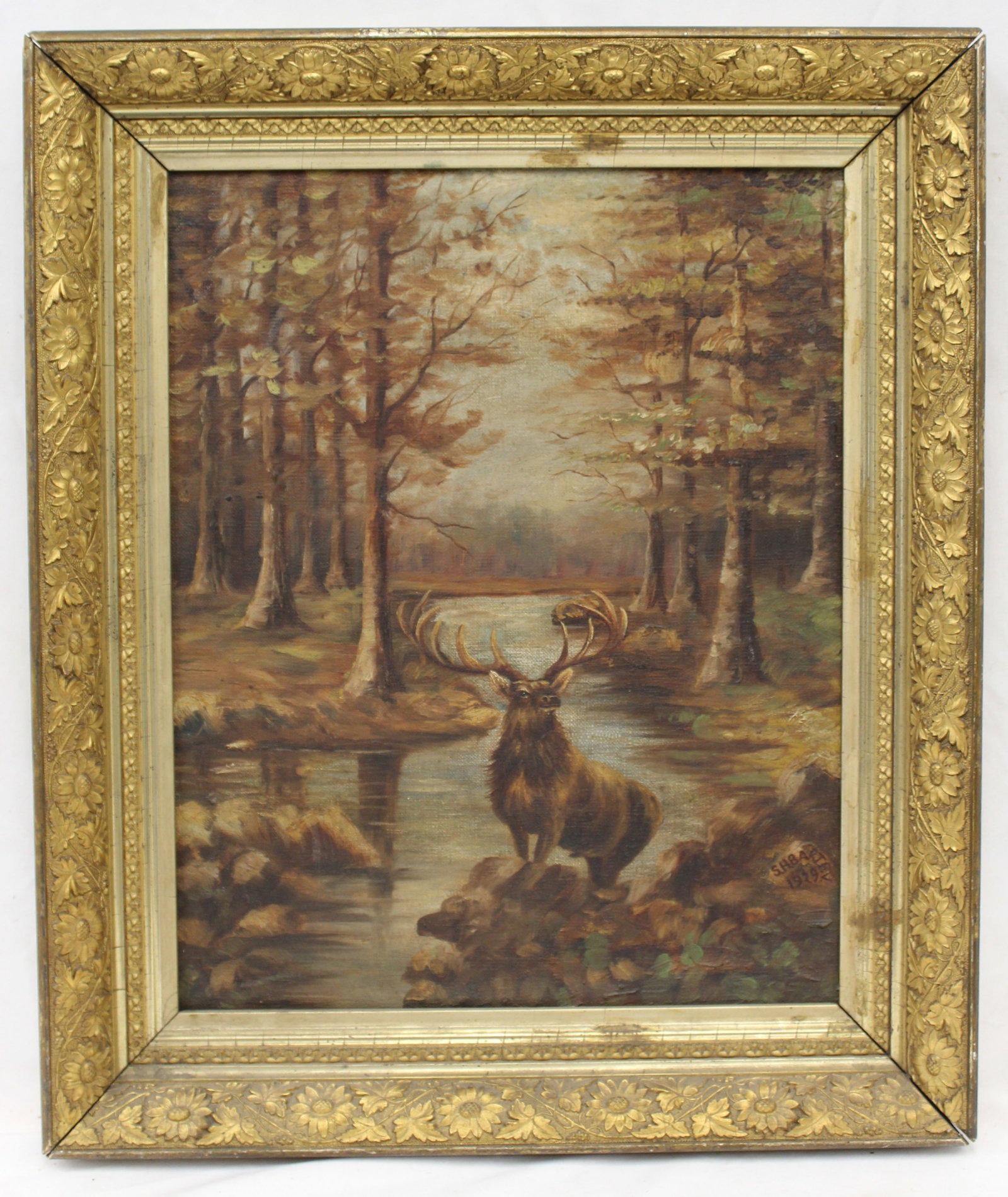 Signed S.H. Bartley oil on canvas of an elk in forest riverscape dated 1929 - overall framed size 21: Signed S.H. Bartley oil on canvas of an elk in forest riverscape dated 1929 - overall framed size 21 1/4"x18 3/4"