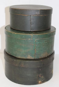 Stack of 3 antique pantry boxes in green paint - 3 1/2"x7" diam, 4"x8 1/2" diam & 4 1/2" x 8 1/2"