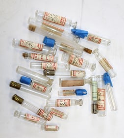 Lot of approx 24 French labeled perfume bottles/vials, labeled 'turpentine' sample bottle "Verrerie