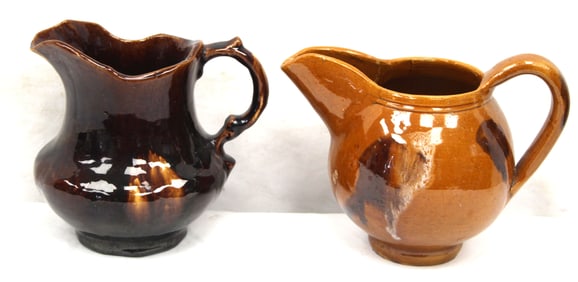 Lot of 2 redware pitchers -