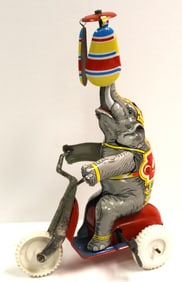Tin wind up elephant riding tricycle - 8 3/4" tall
