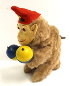 Tin wind up furry monkey w hand balls - 7" tall