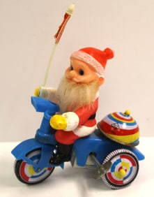 Tin wind up Santa on tricycle - 7"x4 1/2"