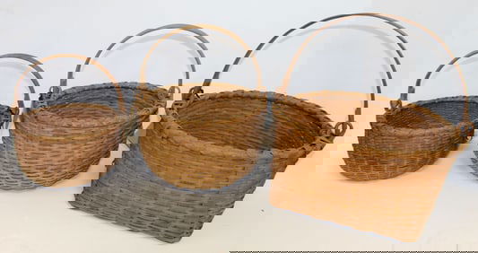 Nest of 3 graduated sizes Taghkanik swing handled baskets - 4"x8" diam, 5"x9" diam & 6"x13" diam