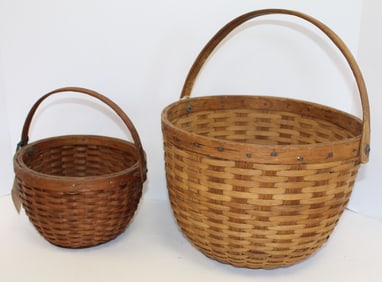 Lot of 2 W.E. Joy swing handled baskets w labels - 5 3/4"x8" diam & 7 1/4"x13" diam