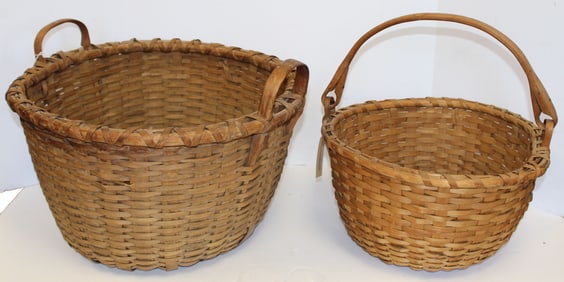 Lot of 2 baskets incl gathering basket w ears & a swing handled - 13"x18" diam & 8 1/2"x15" diam