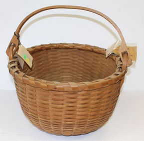 Half bushel swing handled basket with mailing label and inscribed on bottom "For A.M.B. Taylor from