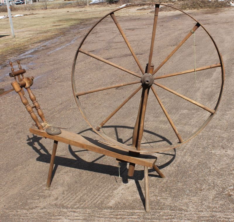 large antique spinning wheel