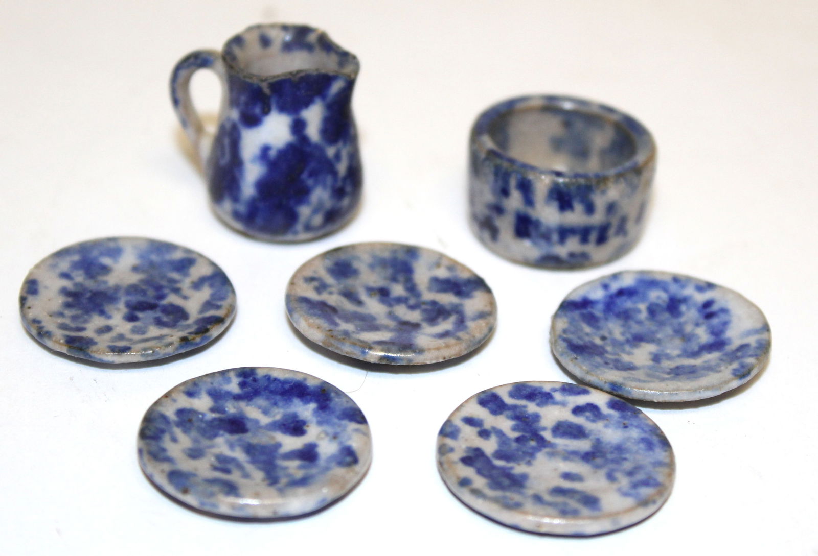 Lot of 7 miniature spongeware items incl a bowl, pitcher & 5 saucers signed NS - 1" diam plates (1 of 4)