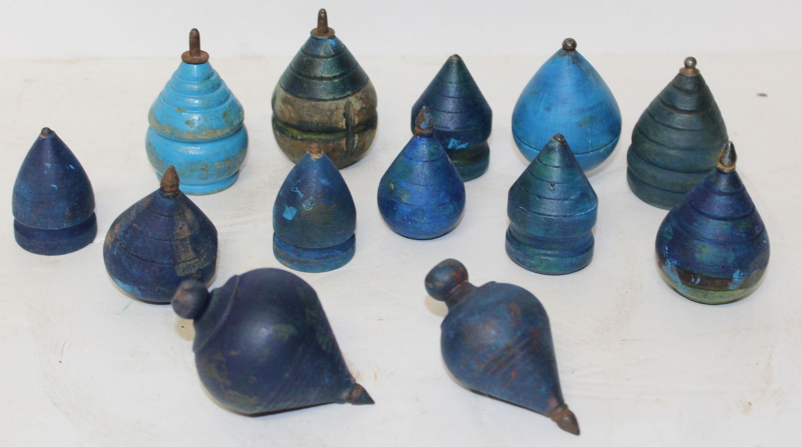 Lot of 13 wooden painted blue spinning tops - approx 2"-2 1/2": Lot of 13 wooden painted blue spinning tops - approx 2"-2 1/2"