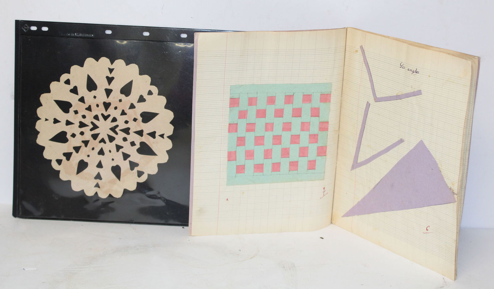 Heart paper cutting together w a French book w various cuttings & weavings (1 of 9)