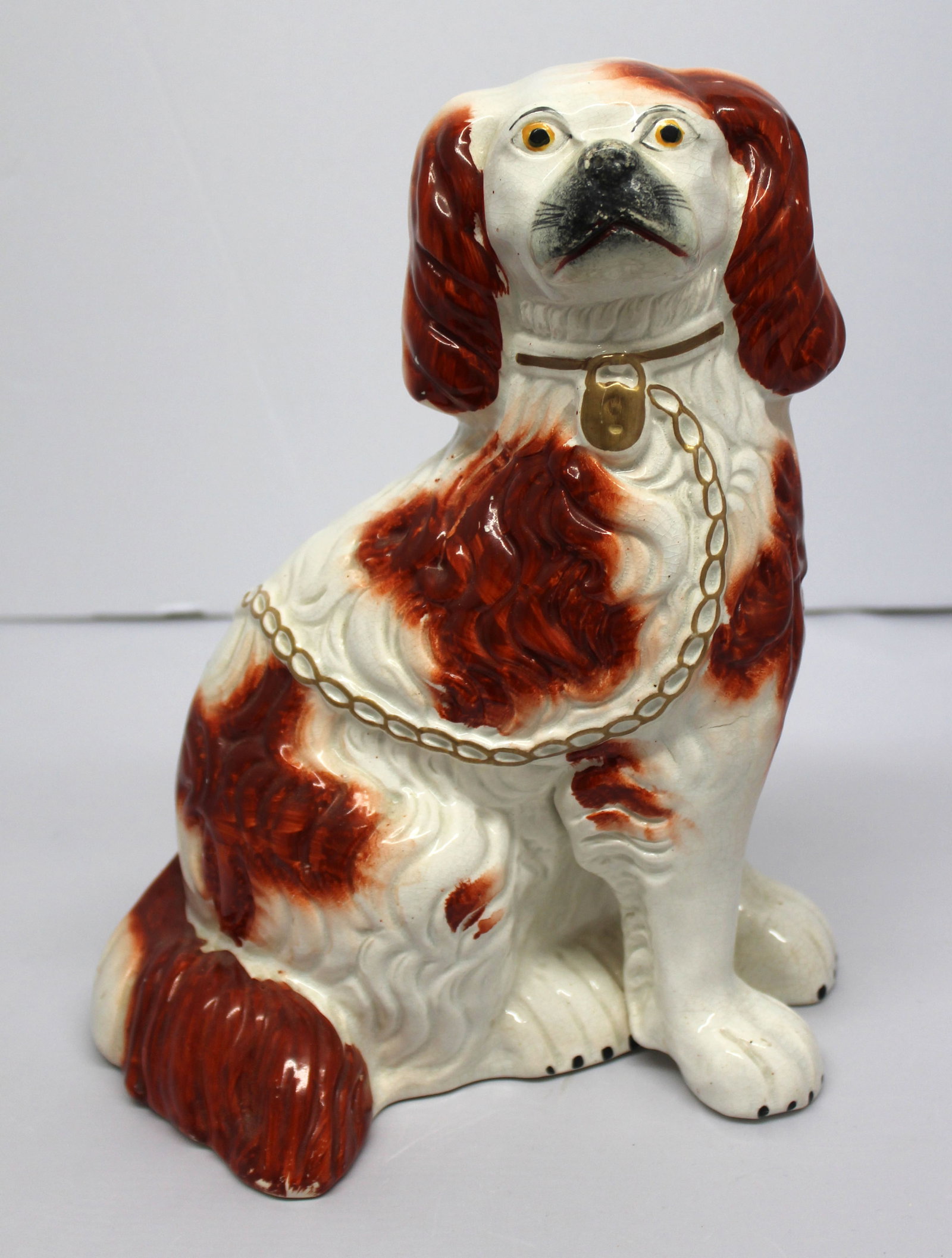 Staffordshire brown & white single leg Spaniel w gold bow - 11" tall: Staffordshire brown & white single leg Spaniel w gold bow - 11" tall