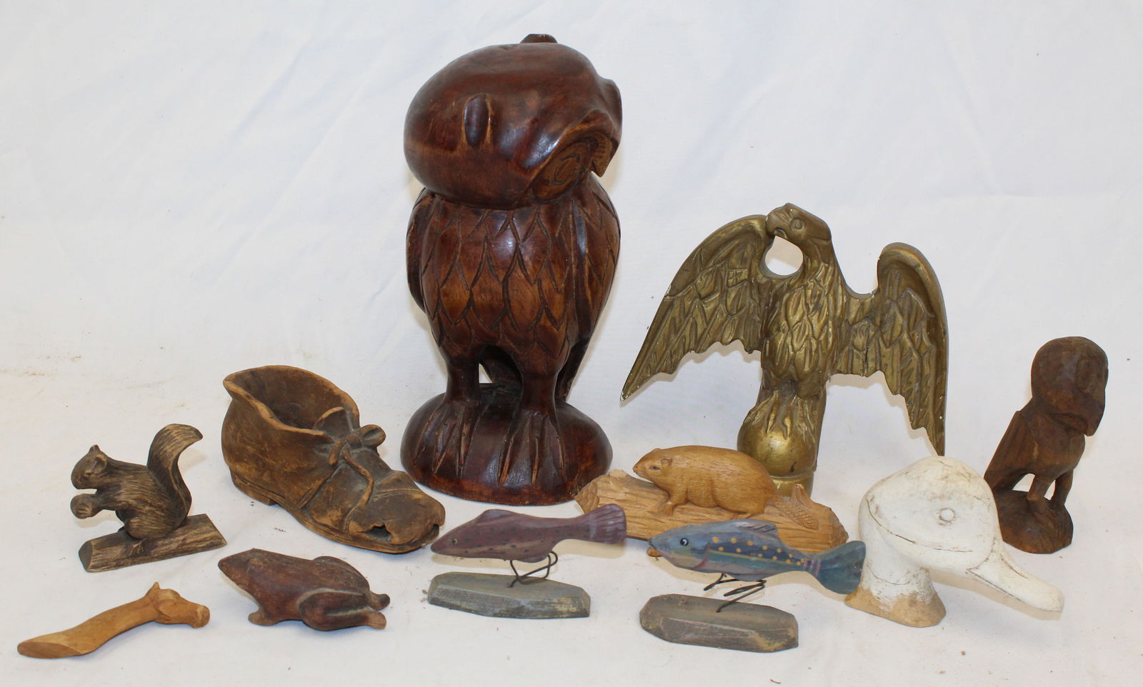 Lot of interest wood carvings of mostly animals incl owl, squirrel, fish, plus a decoy head, a shoe (1 of 12)