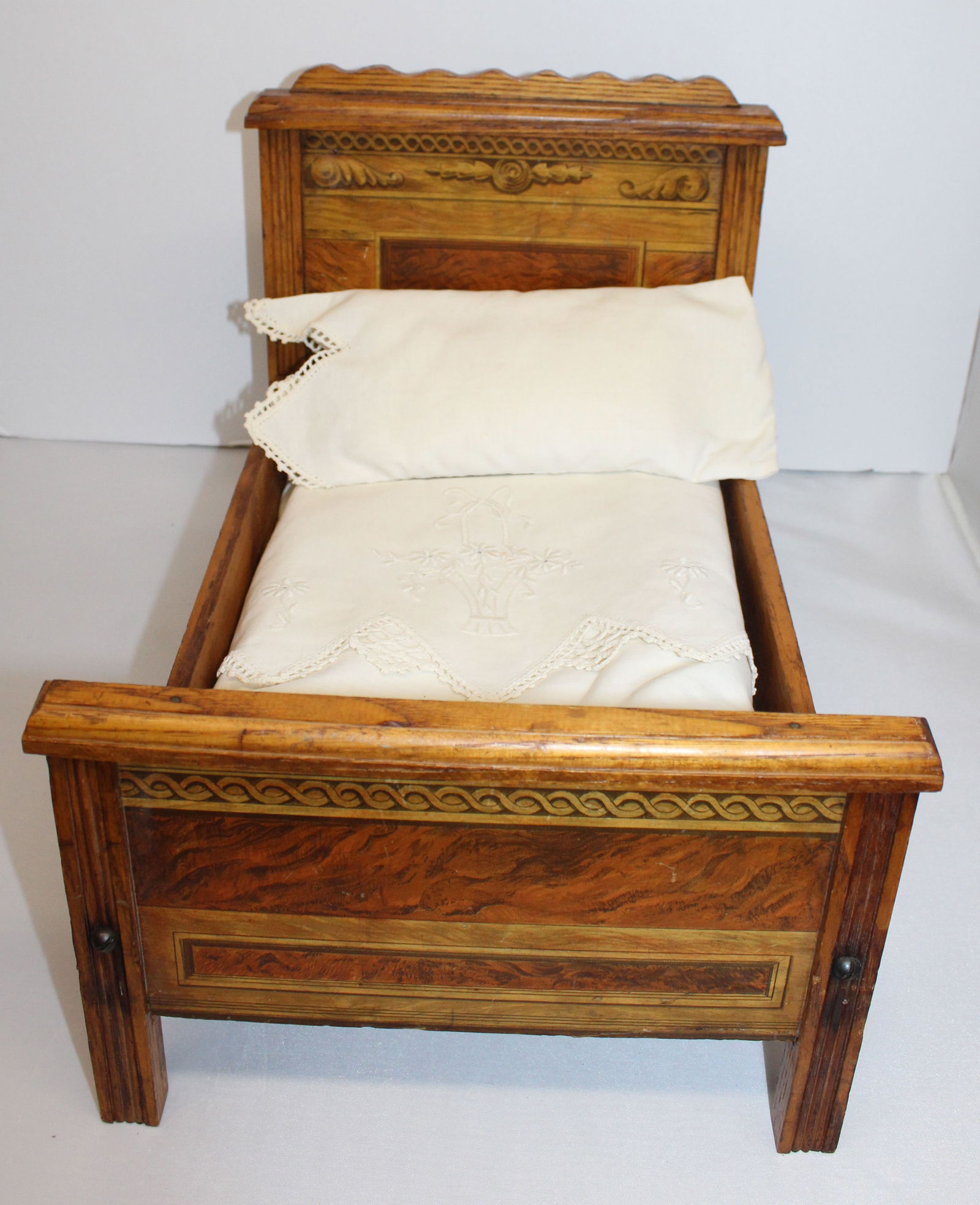 Antique doll bed w decorated headboard & footboard - 11" tall x 10 1/2" wide x 15 1/2" long (1 of 5)