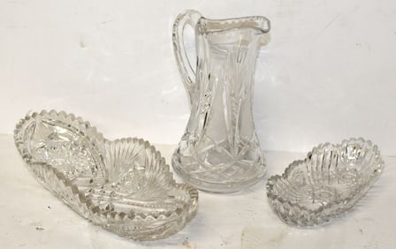 Lot of 3 cut glass pieces incl 2 celery dishes & a pitcher - 10" & 8" long & 8" tall