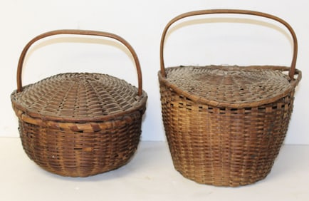 Lot of 2 antique covered fixed handled baskets - 10" tall x 10" diam & 11" tall x 9" diam