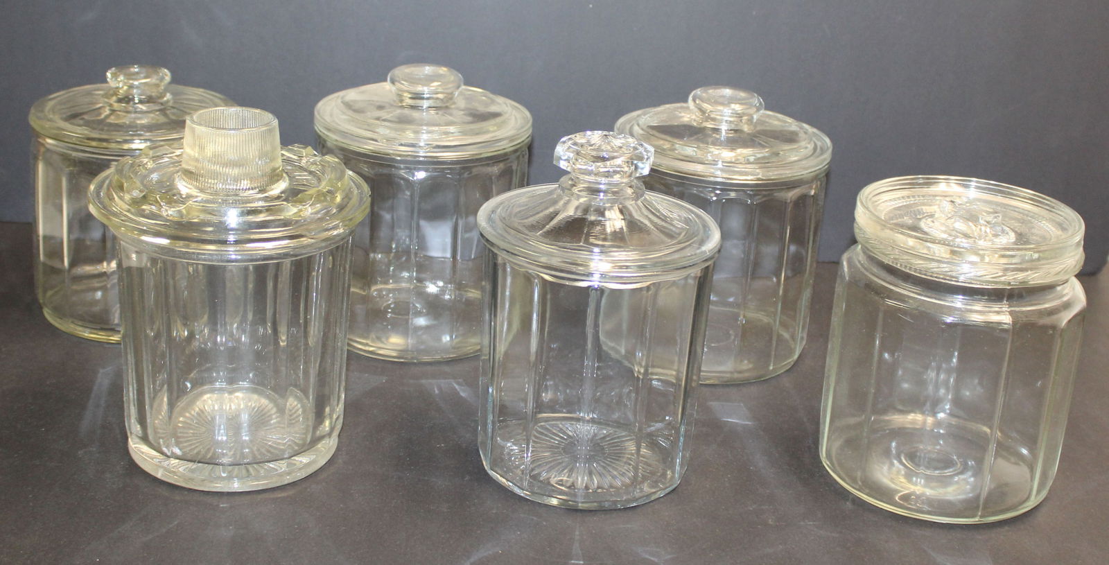 Lot of 6 glass covered tobacco jars - 6"- 8 1/2" tall: Lot of 6 glass covered tobacco jars - 6"- 8 1/2" tall