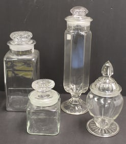 Lot of 4 glass apothecary jars in various shapes & sizes - 7", 10 1/2", 11" & 13" tall