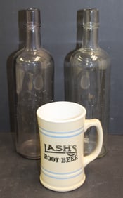Lash's Bitters/Rootbeer lot incl 2 glass bottles & a porcelain mug - 5 1/5" mug & 11 1/4" tall