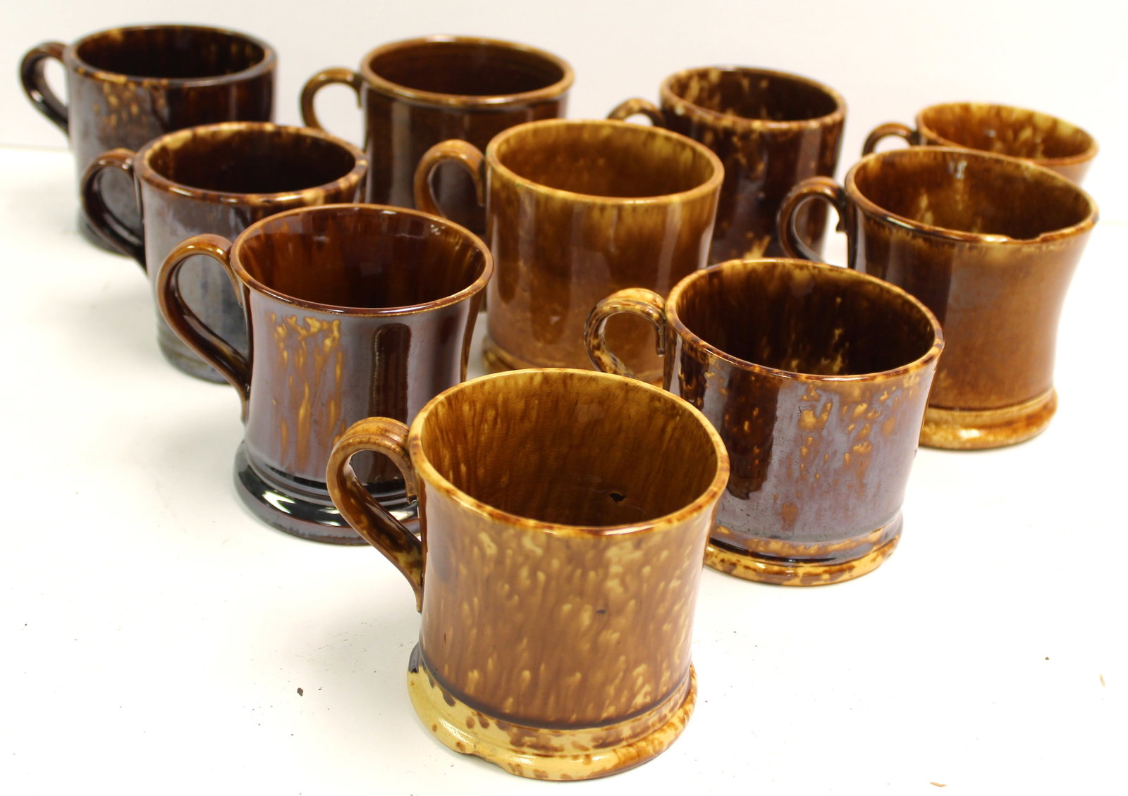 Lot of 10 Bennington/Rockingham mugs: Lot of 10 Bennington/Rockingham mugs