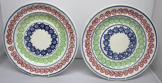 Pair of Stick Spatter plates in red, green & blue - w hearts border & floral centers - 10 1/4" diam