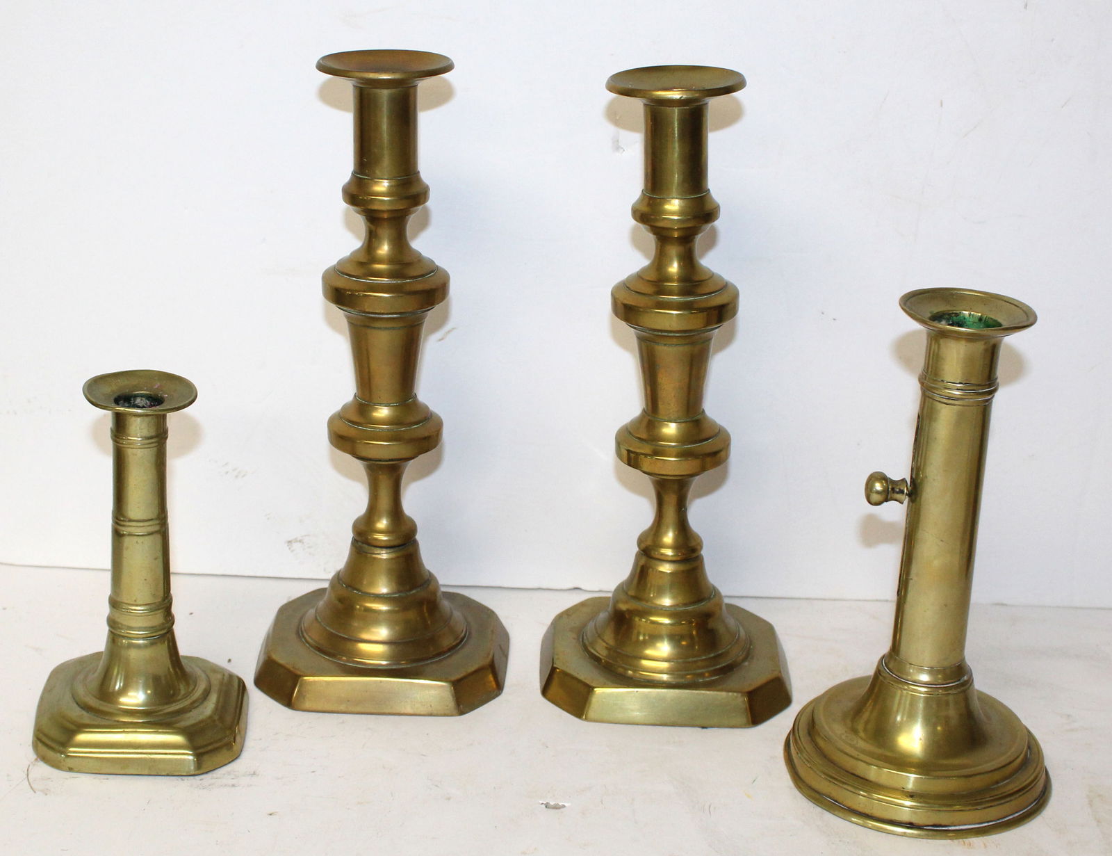 Lot of 4 antique brass candlesticks incl a pr & 2 push ups - 6"-10 1/4" tall (1 of 8)